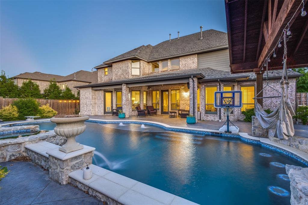 View of swimming pool with a fenced backyard, a patio area, and a hot tub