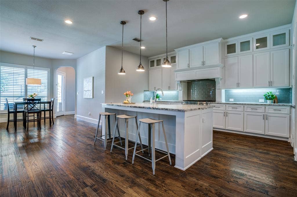 Kitchen featuring huge island with breakfast bar