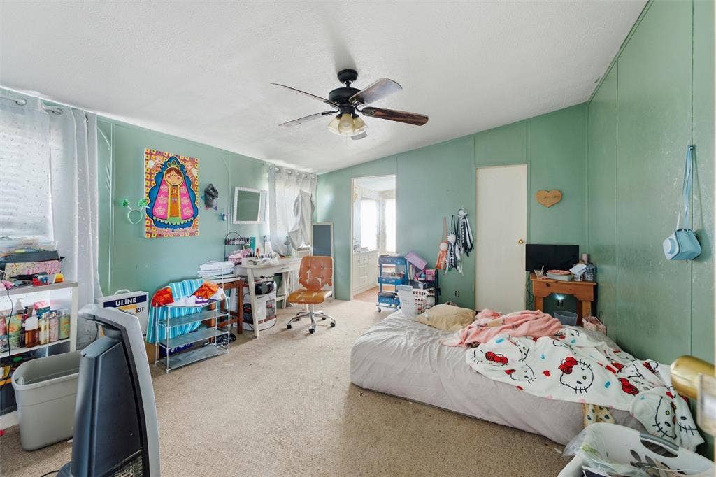 902 Old Church Rd, Waxahachie, TX 75165 Interior room featuring wall-to-wall carpeting and a ceiling-mounted fan with integrated light fixture