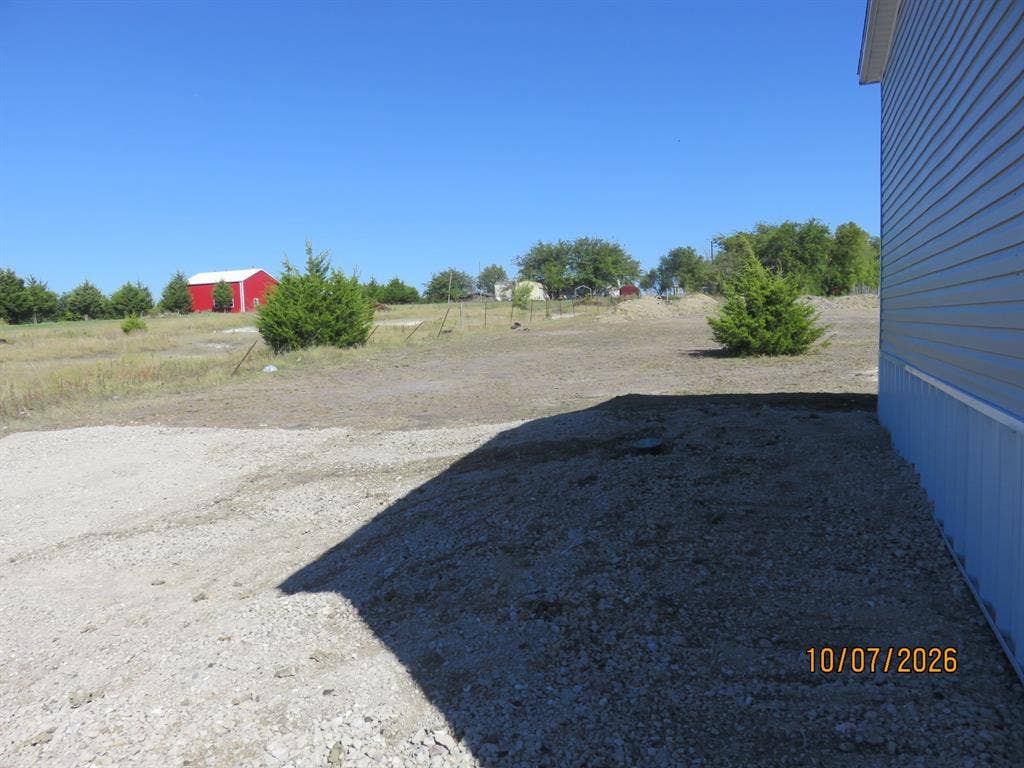 1327 County Road 1077, Farmersville, TX 75442 side yard with extra parking
