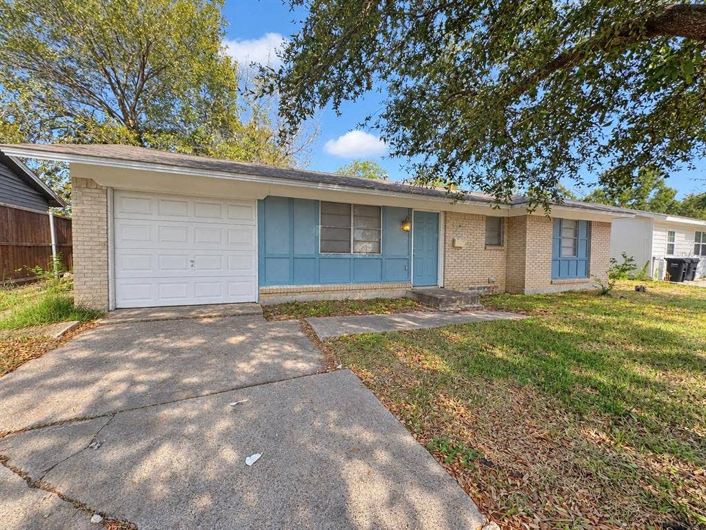 2418 Fulton Drive, Mesquite, TX 75150 Single-story residence featuring a brick facade, panelized accent siding, an attached single-car garage, and concrete driveway