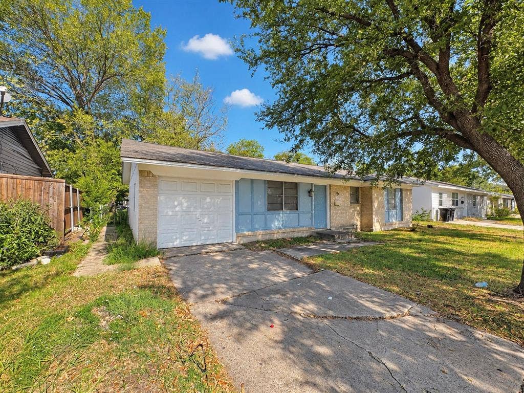 2418 Fulton Drive, Mesquite, TX 75150 Single-story exterior featuring a brick facade, attached one-car garage, concrete driveway, and mature landscaping