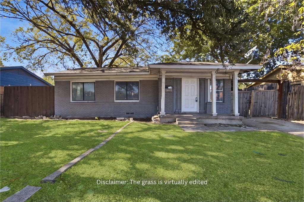 2009 S 1st Street, Garland, TX 75041 Single-story exterior featuring painted brick siding, a covered front porch with support columns, and wood-panel fencing