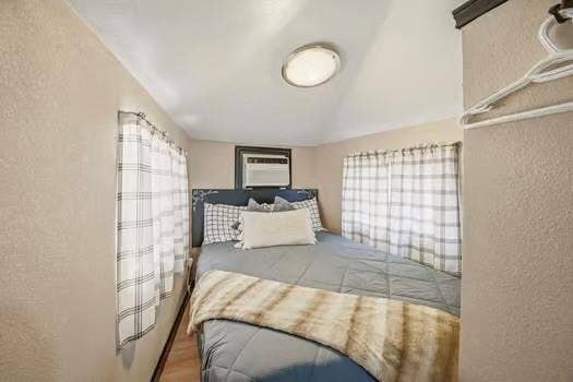 TV to watch in double bed on opposite wall