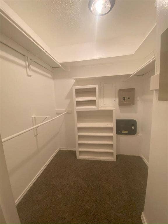 8110 Skillman Street, #1053, Dallas, TX 75231 Walk in closet featuring dark colored carpet
