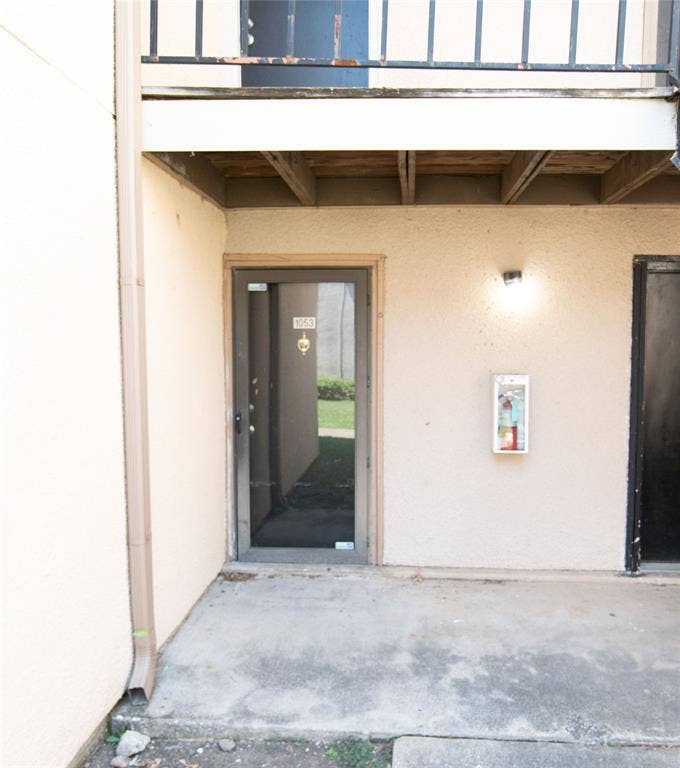 8110 Skillman Street, #1053, Dallas, TX 75231 Entrance to property with stucco siding