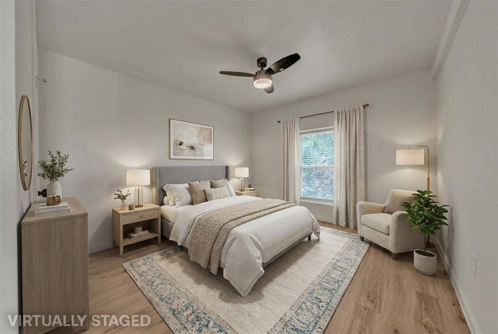 1719 Boot Hill Road, Granbury, TX 76049 Room featuring wood-finish flooring, a neutral color palette, and a multi-blade ceiling fan with integrated lighting