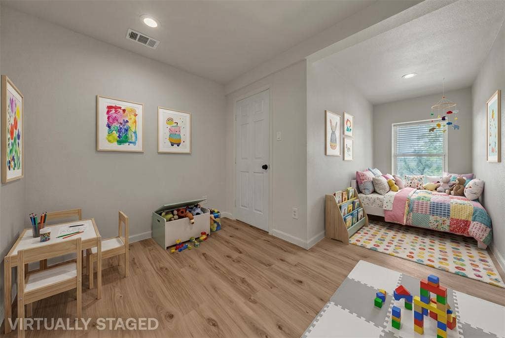 1719 Boot Hill Road, Granbury, TX 76049 Neutral-toned room featuring wood-finish flooring, recessed lighting, and a window with horizontal blinds