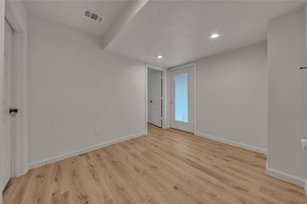 1719 Boot Hill Road, Granbury, TX 76049 Interior space featuring wood-finish flooring, recessed lighting, and a glass-paneled exterior door