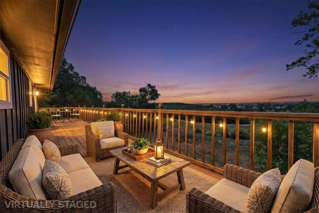 1719 Boot Hill Road, Granbury, TX 76049 Expansive wooden deck featuring horizontal plank flooring, vertical timber railing, and perimeter string lighting