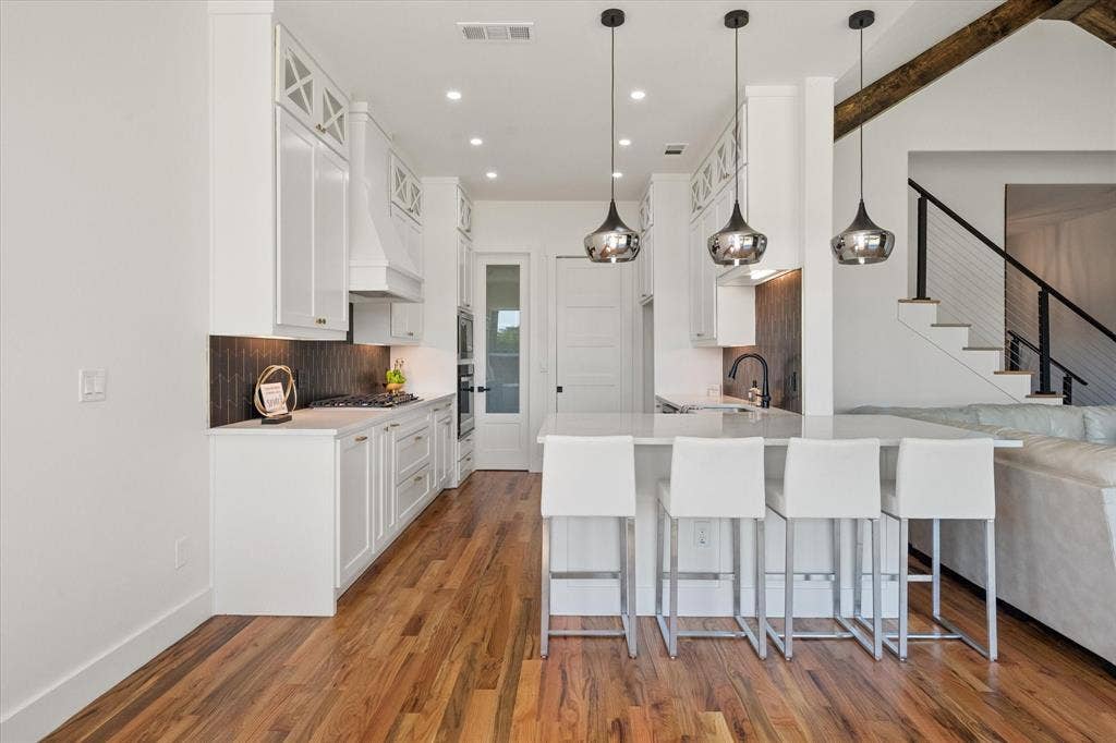 122 Yvonne Street, Red Oak, TX 75154 Kitchen featuring 42" custom cabinets, oak wood, recessed lighting, modern pendant lighting and Whirlpool appliances