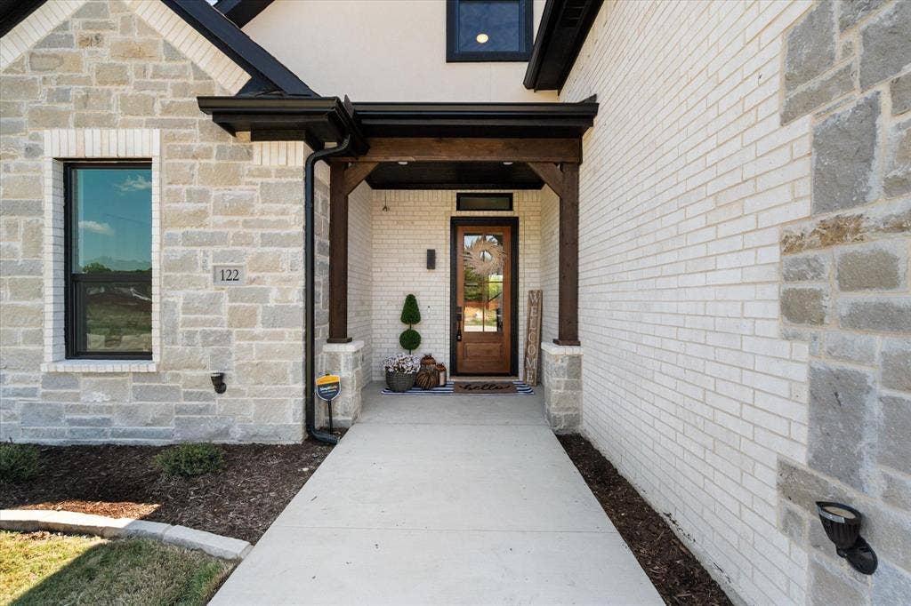 122 Yvonne Street, Red Oak, TX 75154 Gorgeous entry with an extended sidewalk, and cedar beams.