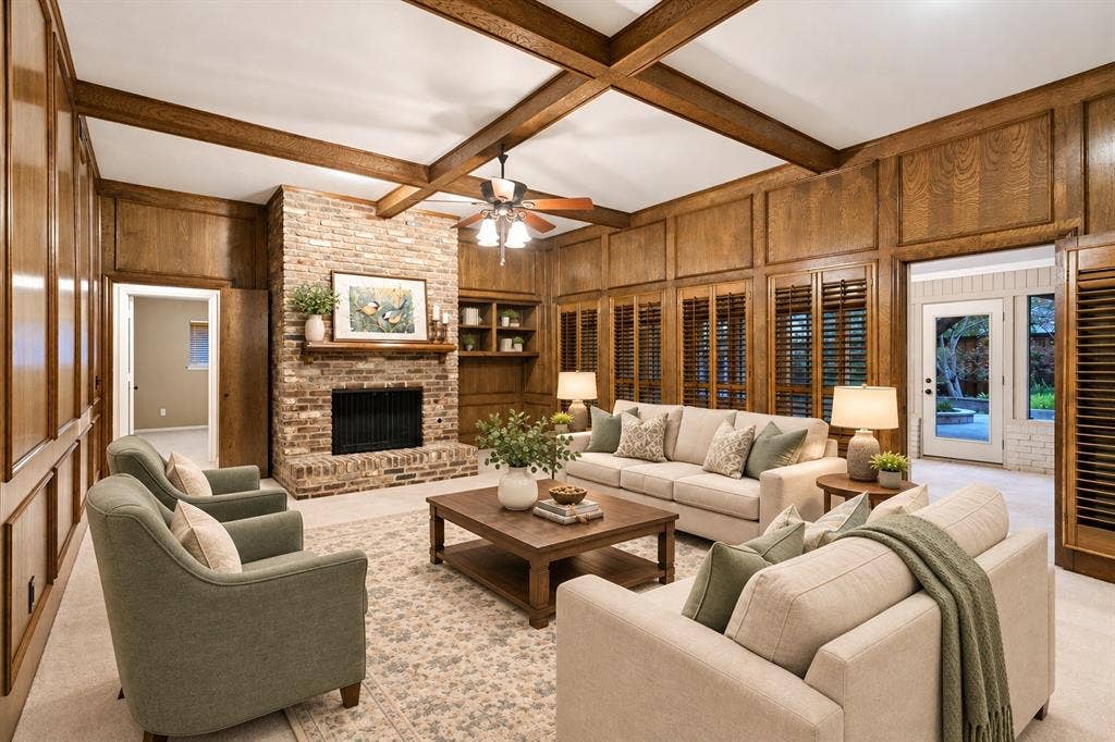 2404 Monmouth Court, Plano, TX 75075 Gather here for great conversation and warmth in this great room w beamed ceiling and rich, warm paneling, gas FP and raised hearth -virtual staging
