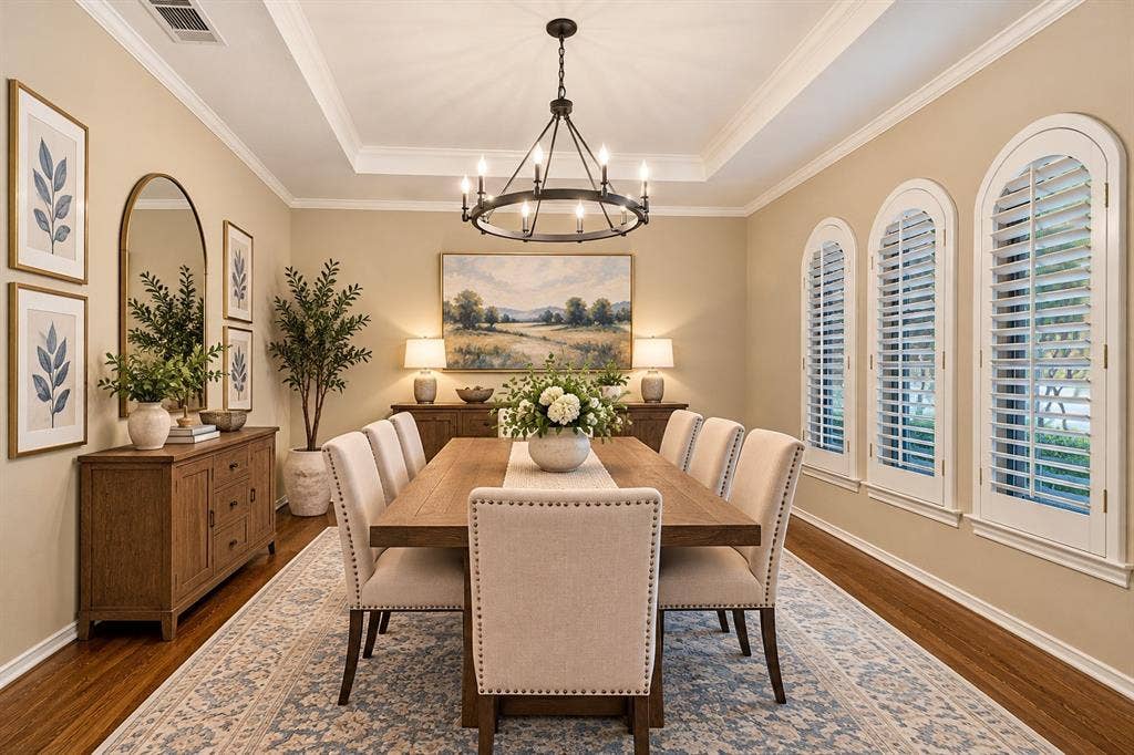 2404 Monmouth Court, Plano, TX 75075 Timeless hardwood flooring in formal dining along w white shutters, chandelier and crown molding - virtual staging