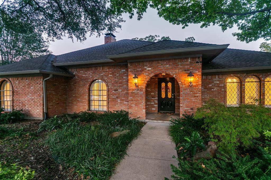 2404 Monmouth Court, Plano, TX 75075 Filled with beautiful landscaping along the lead walk to front door