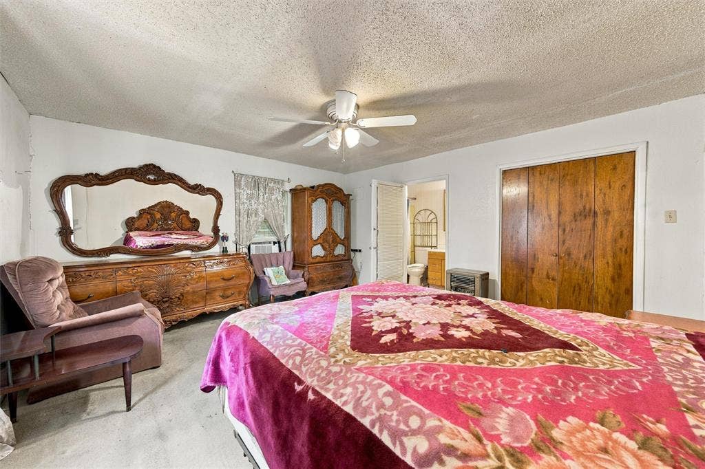 1703 Arra Street, Waco, TX 76704 Room featuring a ceiling fan with integrated lighting and wood-finish closet doors