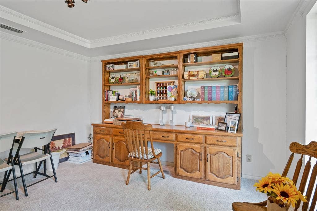 621 Harvest Glen Drive, Richardson, TX 75081 Custom built-in oak desk and shelving unit, tray ceiling, and crown molding