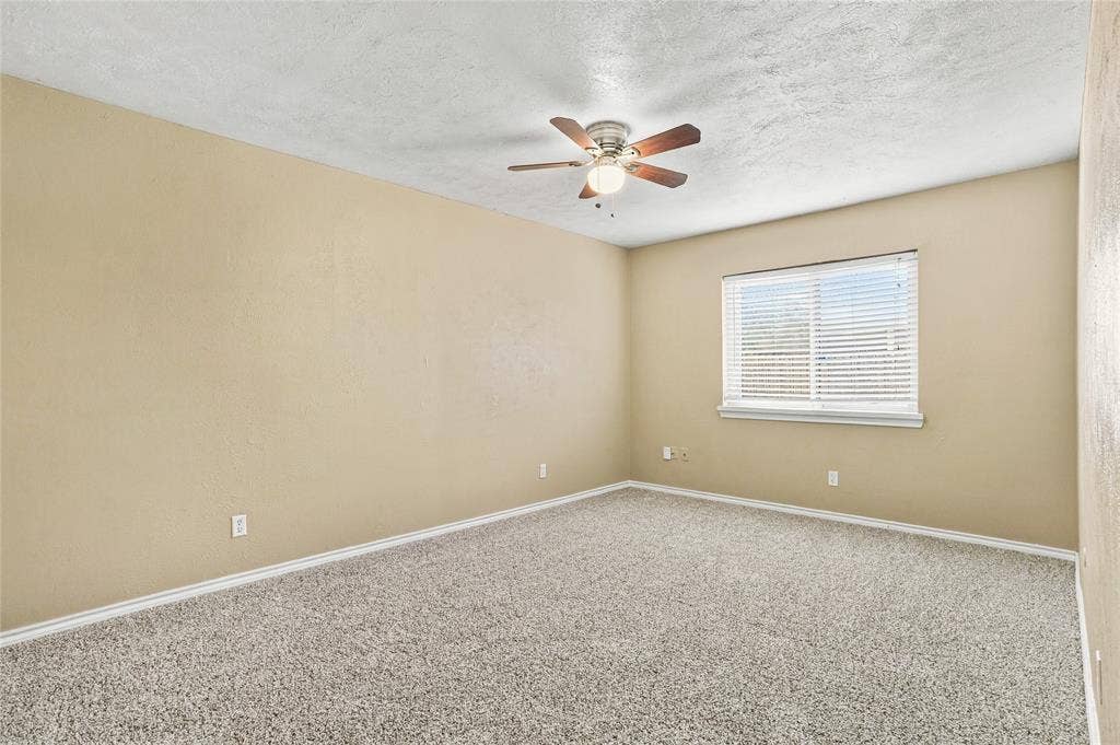 1901 Dodge Trail, Grand Prairie, TX 75052 Bedroom with carpeted flooring, neutral finishes, a ceiling fan, and an open layout
