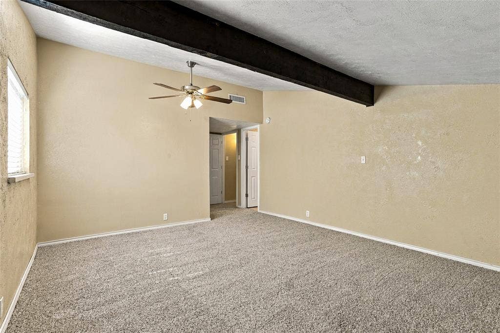 1901 Dodge Trail, Grand Prairie, TX 75052 Generously sized bedroom with carpeted flooring, neutral finishes, a ceiling fan, and an open layout.