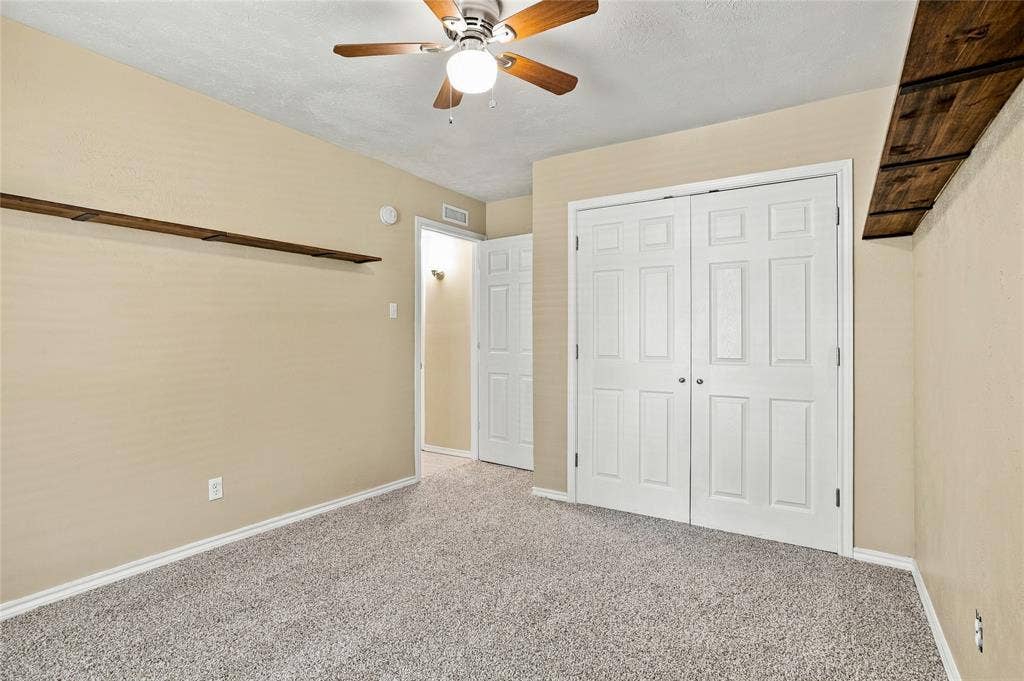 1901 Dodge Trail, Grand Prairie, TX 75052 Bedroom with carpeted flooring, neutral finishes, a ceiling fan, and an open layout