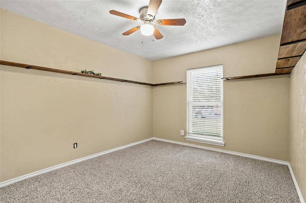 1901 Dodge Trail, Grand Prairie, TX 75052 Bedroom with carpeted flooring, neutral finishes, a ceiling fan, and an open layout