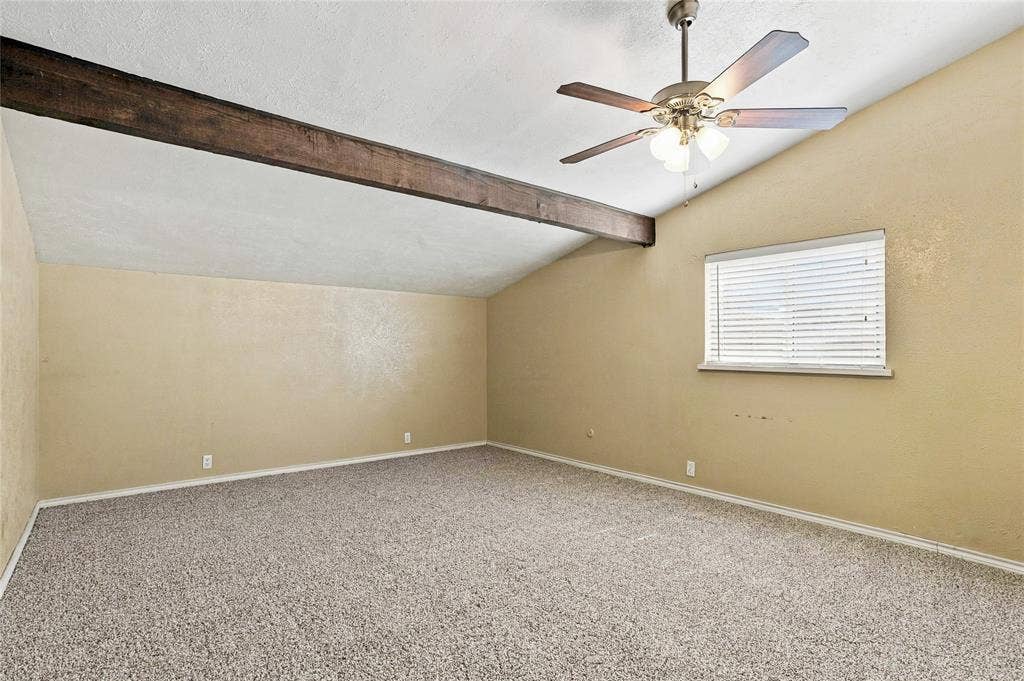 1901 Dodge Trail, Grand Prairie, TX 75052 Bedroom featuring neutral walls, carpeted flooring, a ceiling fan, and a large window for natural light.
