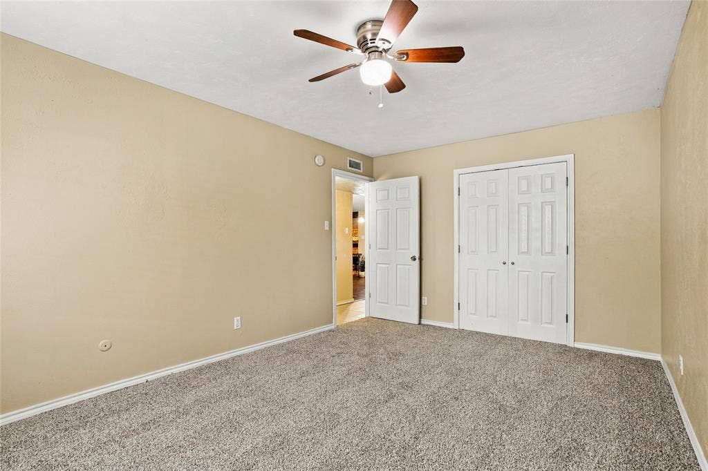 1901 Dodge Trail, Grand Prairie, TX 75052 Bedroom with carpeted flooring, neutral finishes, a ceiling fan, and an open layout