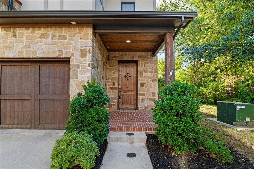 7108 Brisa Drive, Dallas, TX 75223 2 car garage with direct access to home, green space next to and behing the home