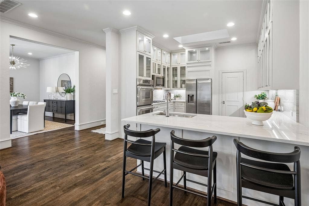 Breakfast bar with dining room in background