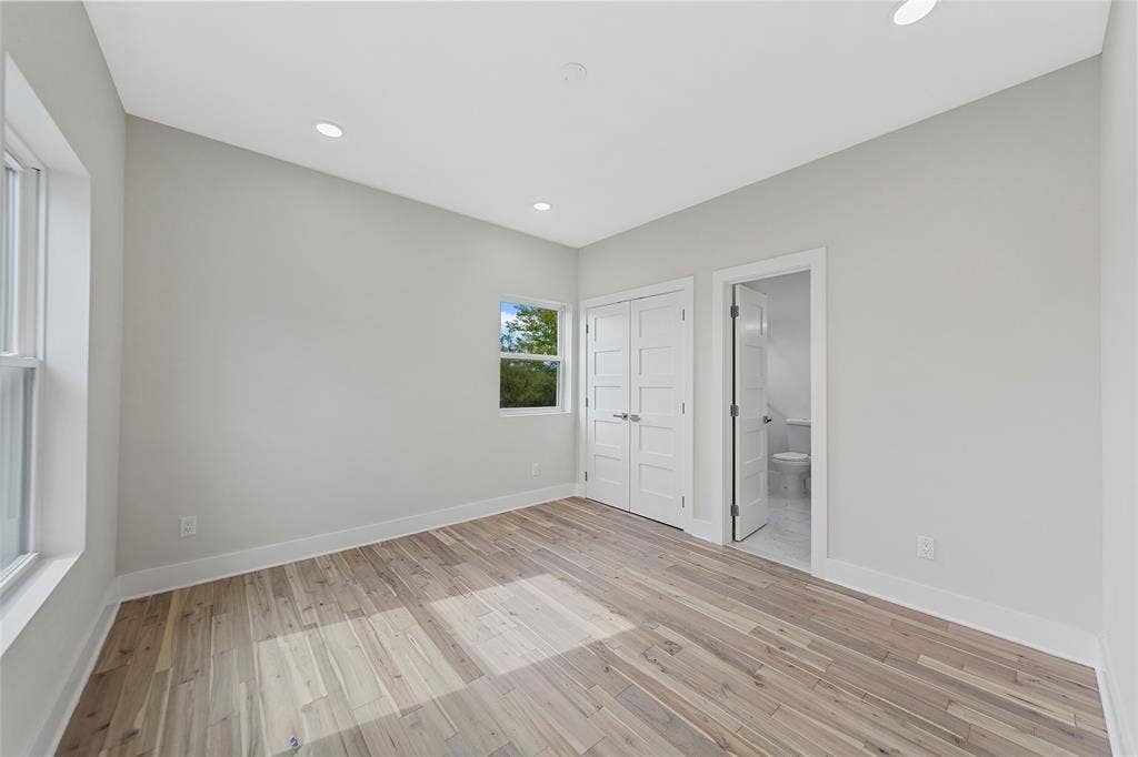 2503 Crossman Avenue, Dallas, TX 75212 Neutral-toned interior featuring wood-finish flooring, recessed lighting, multi-panel doors, and crisp white trim