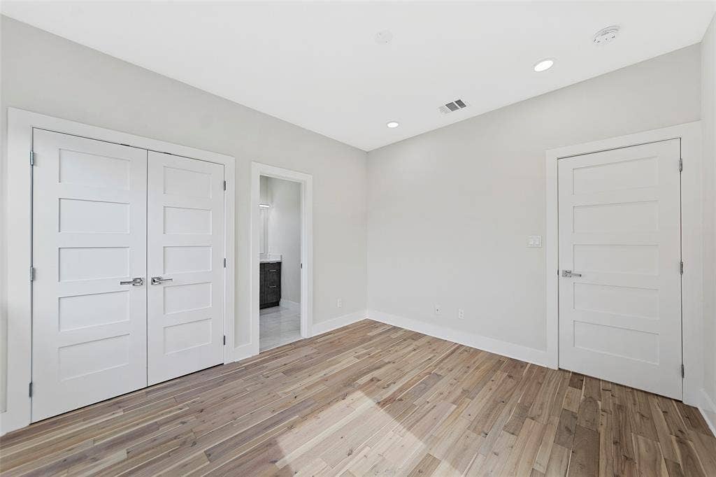 2503 Crossman Avenue, Dallas, TX 75212 Interior space featuring wood-finish flooring, recessed lighting, and white four-panel doors