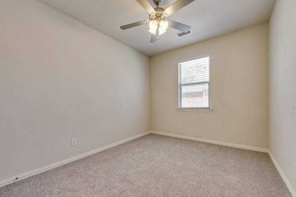 636 S Greenville Avenue, Richardson, TX 75081 Carpeted empty room featuring ceiling fan
