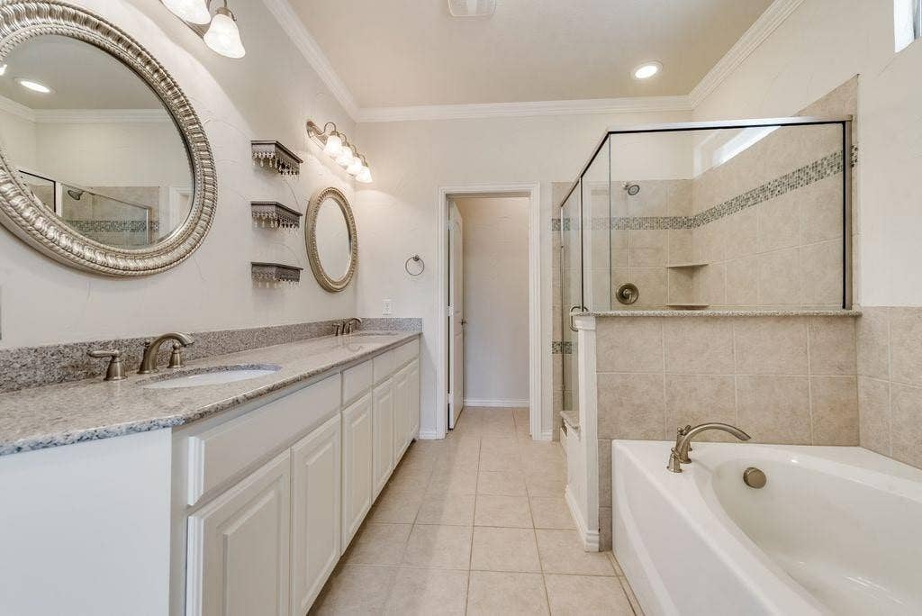 636 S Greenville Avenue, Richardson, TX 75081 Bathroom with ornamental molding, vanity, tile patterned flooring, and shower with separate bathtub
