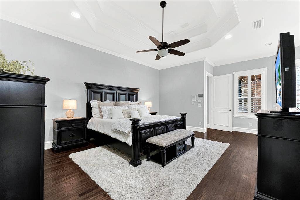 2608 LAWTON Lane, Plano, TX 75093 Clean, soft-toned walls provide a restful backdrop that accentuates the room's generous proportions and high ceiling lines. Imagine waking up rested on a quiet Sunday morning, watching rays of light trickle through the window shutters.
