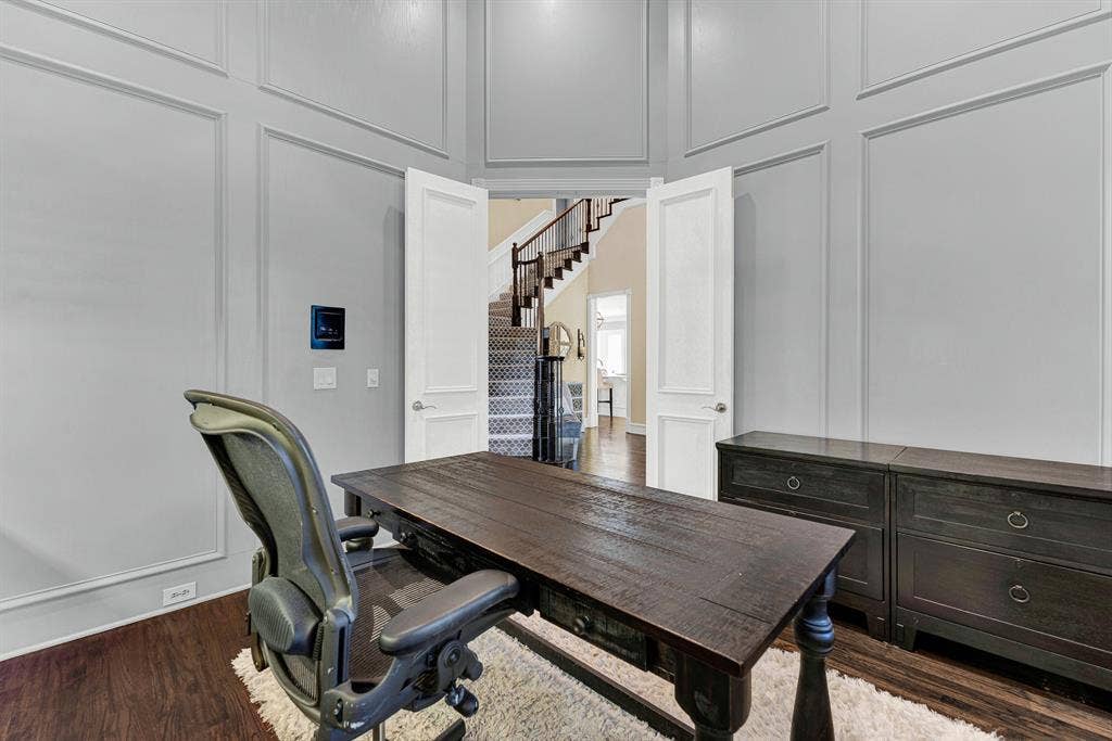 2608 LAWTON Lane, Plano, TX 75093 Crisp double doors frame a sweeping vantage point directly into the main hallway, creating a seamless indoor flow. Picture wrapping up afternoon calls with total privacy, then stepping straight into the main living space to host guests.