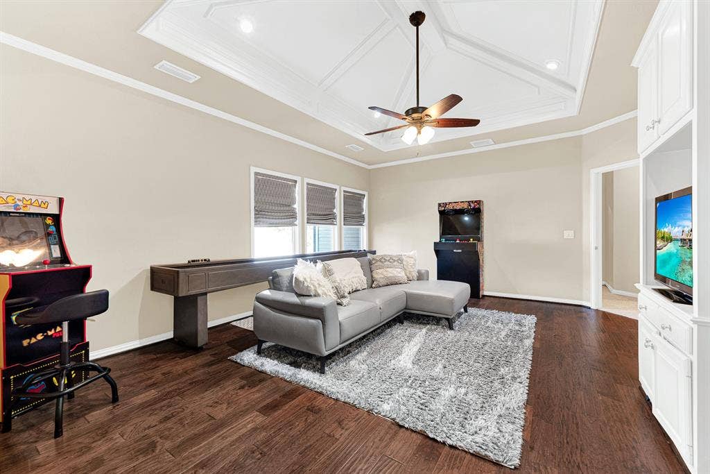 2608 LAWTON Lane, Plano, TX 75093 A geometric, recessed tray ceiling brings elevated architectural detail to this expansive hardwood lounge. You will love inviting friends over for casual game nights that carry on long after sunset.