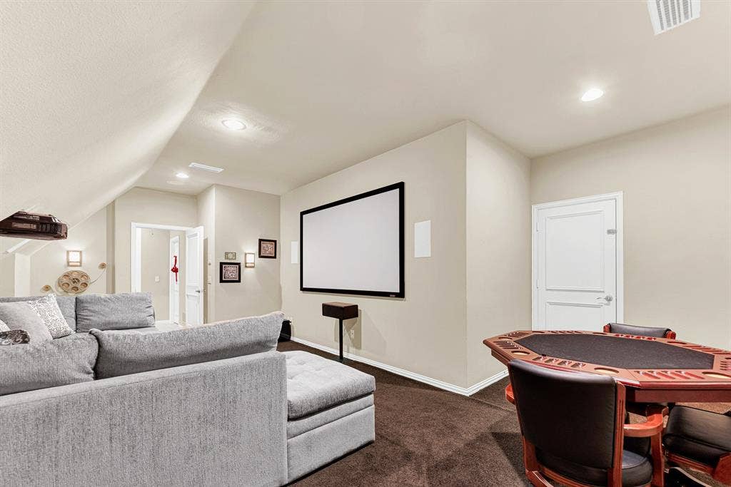 2608 LAWTON Lane, Plano, TX 75093 Recessed spotlighting and soft wall sconces provide customizable ambient light around the home cinema projection screen. It is a wonderful hideaway to host high-stakes poker nights or stream live sports weekend events.