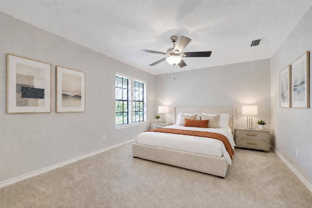 12627 Breckenridge Drive, #200, Dallas, TX 75230 Neutral-toned room featuring neutral wall-to-wall carpeting, a multi-blade ceiling fan with an integrated light fixture, and windows with grid-patterned panes