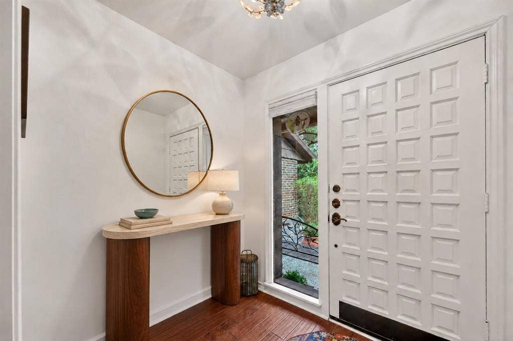 12627 Breckenridge Drive, #200, Dallas, TX 75230 Entryway featuring wood-finish flooring, a multi-panel exterior door with sidelight, and a decorative ceiling fixture