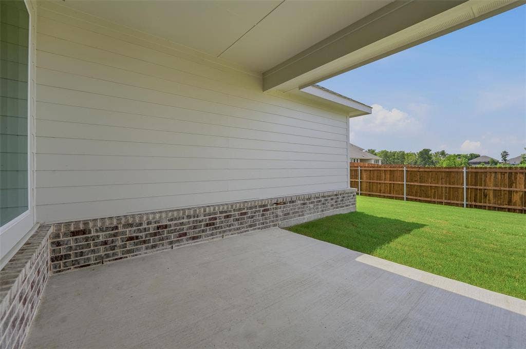 2109 Bluebird Lane, Anna, TX 75409 Expansive outdoor patio with concrete flooring, covered ceiling, and brick and siding exterior