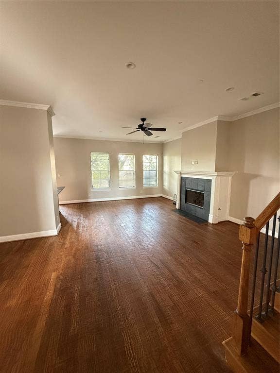 1025 Emerson Park Lane, Irving, TX 75063 Living area featuring wood-finish flooring, fireplace with dark tile surround, triple-pane windows, and ceiling fan