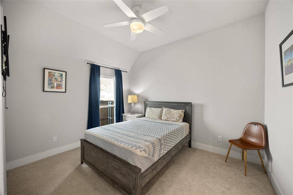 2820 Eccleston Street, Celina, TX 75009 Neutral-toned room featuring high vaulted ceilings, carpeted flooring, and a central white ceiling fan with integrated lighting