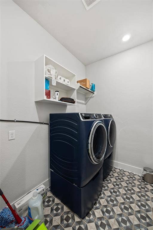 2820 Eccleston Street, Celina, TX 75009 Utility space featuring patterned tile flooring and wall-mounted white cabinetry