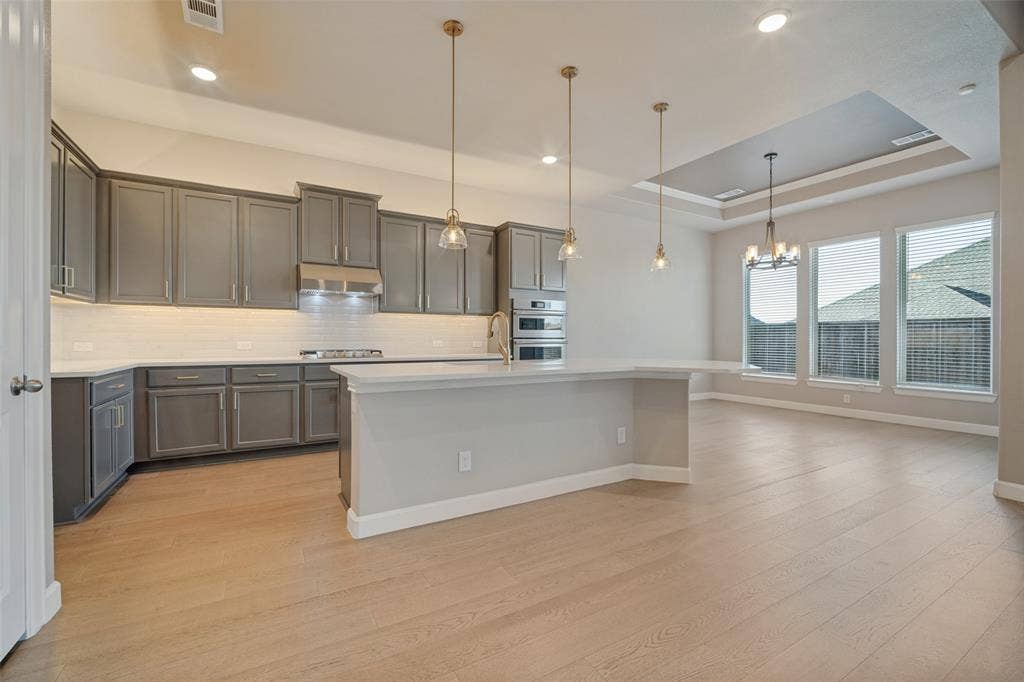You'll love cooking in this stunning neutral clean kitchen bathed in natural light & open to the living and dining room.
