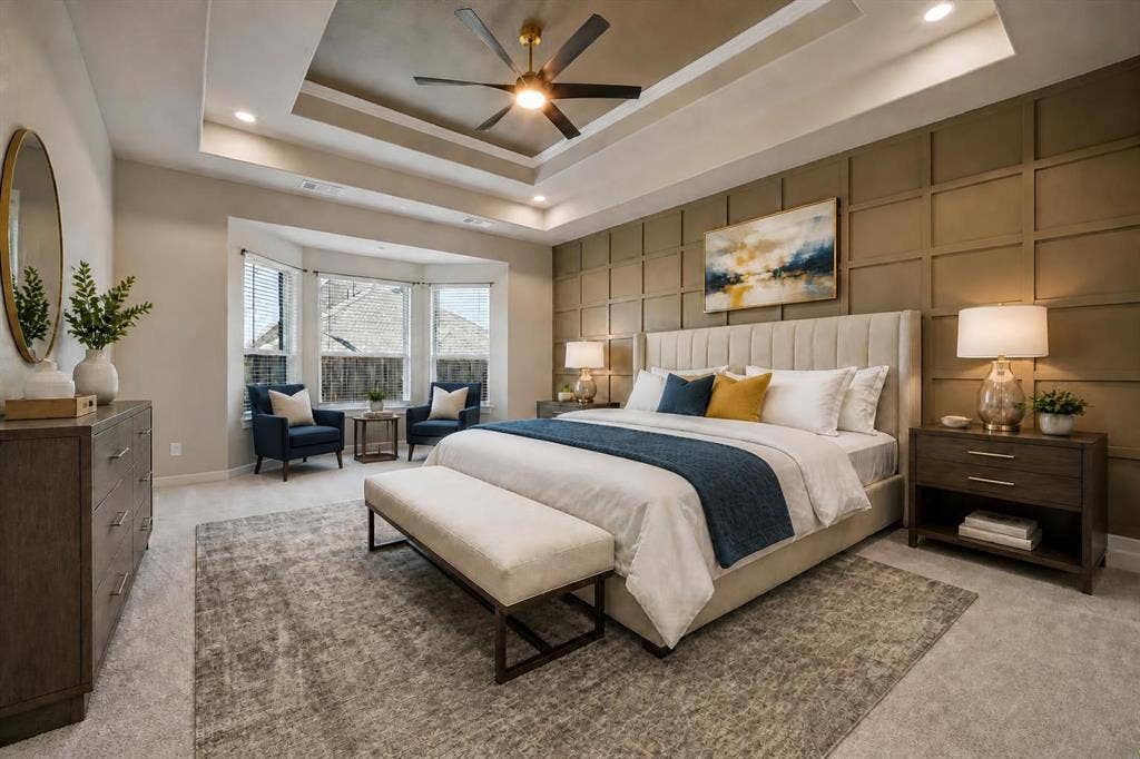 Gorgeous sun bathed primary bedroom with tray ceiling and a stunning feature wall bringing character and warmth; Virtually staged