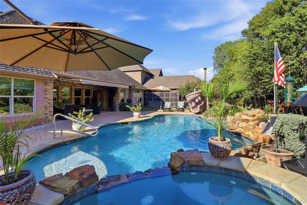 1614 Jeffrey Drive, Wylie, TX 75098 View from spa across pool to covered patio