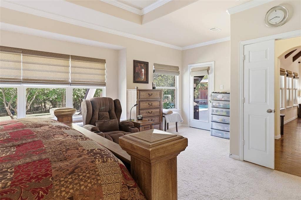 1614 Jeffrey Drive, Wylie, TX 75098 Primary bedroom features a wall of windows to enjoy the majestic peacefulness of the backyard.