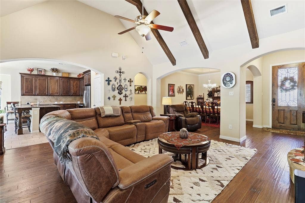 1614 Jeffrey Drive, Wylie, TX 75098 Living room features hard wood floors, beamed elevated ceilings, and fireplace