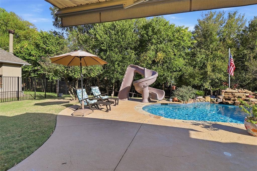 1614 Jeffrey Drive, Wylie, TX 75098 Pool slide, waterfall, grass play area and mature trees