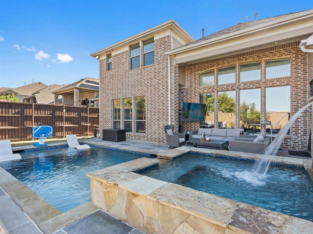 1506 Hennessey Drive, Allen, TX 75013 View of swimming pool featuring a patio, outdoor lounge area, and a pool with connected hot tub